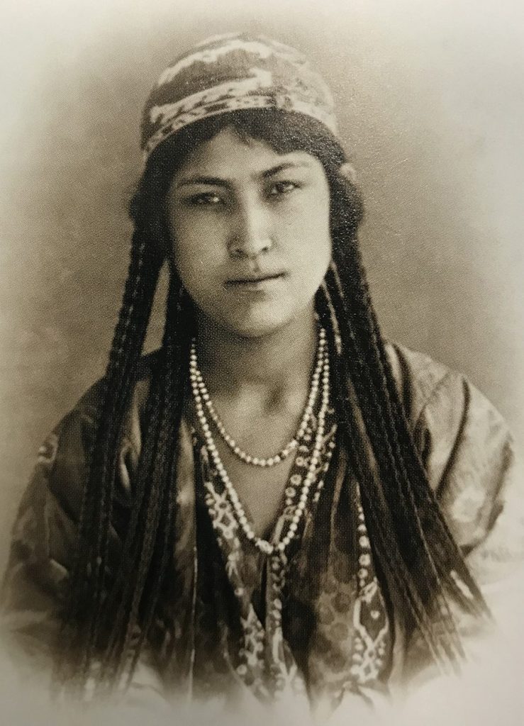 Fig. 6. Kun, Aleksandr L. Tajik Woman: Sharafet-Bibi. 1871-72. Sharafat-bibi wears an Ikat robe over a printed dress and an embroidered skullcap. Library of Congress, Central and South Asia, https://loc.gov/pictures/resource/ppmsca.14288/. 